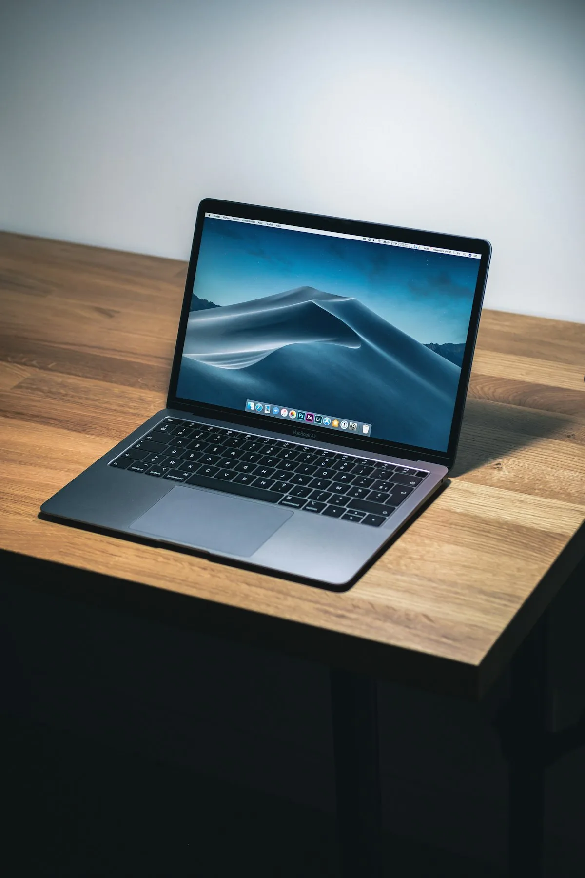 Apple MacBook laptop on a clean white surface, representing the Get a Mac era