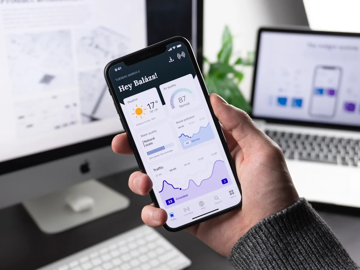 Clean modern app interface design on phone and laptop screens