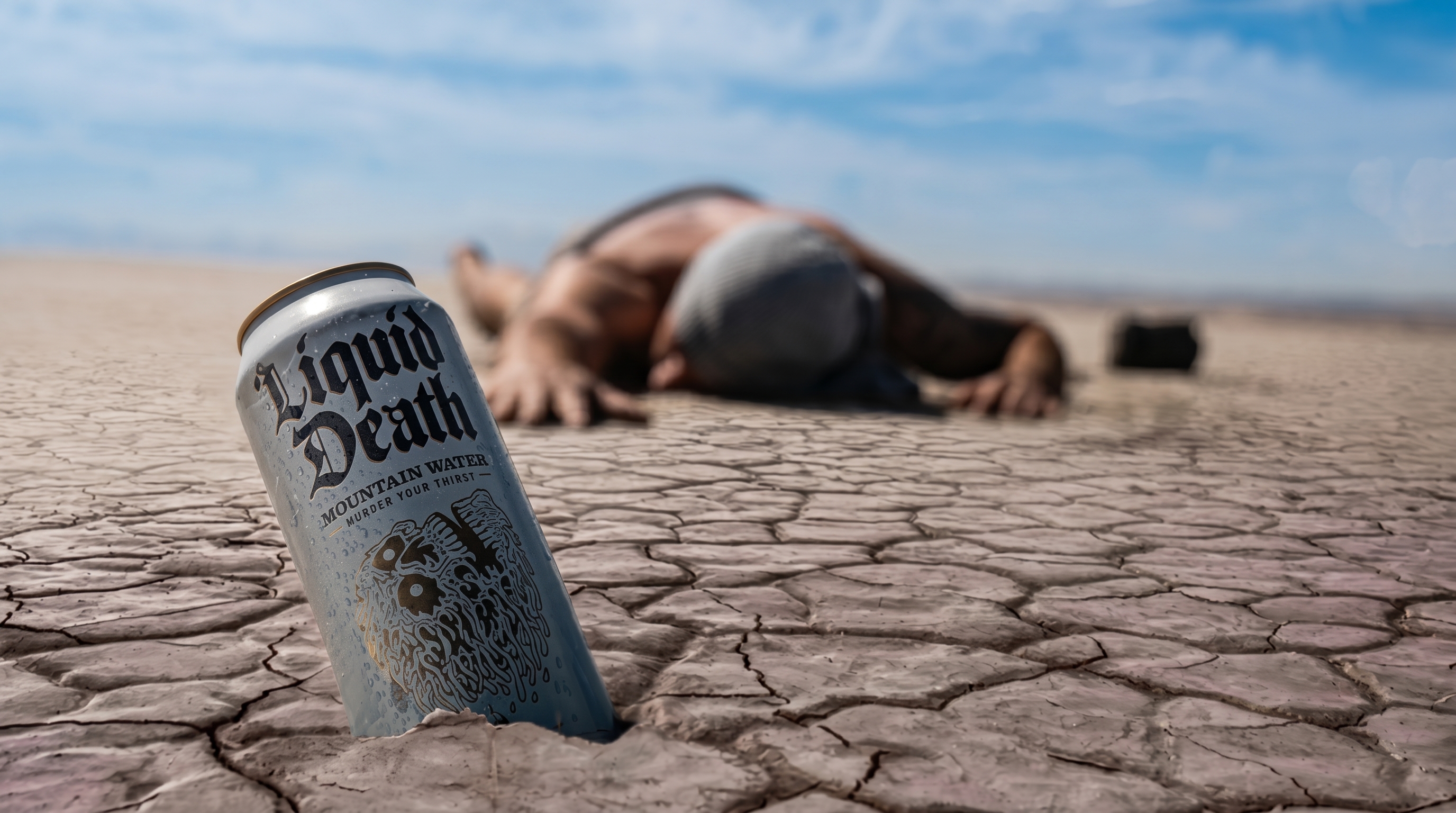 Aluminum can on a dark dramatic background evoking the aesthetic of Liquid Death's metal-inspired branding