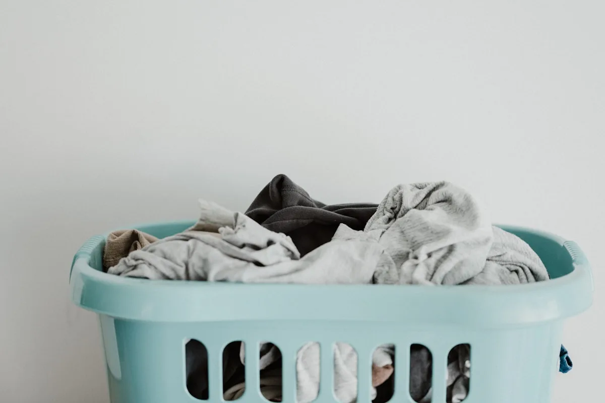 Clean white laundry being folded, fresh and bright