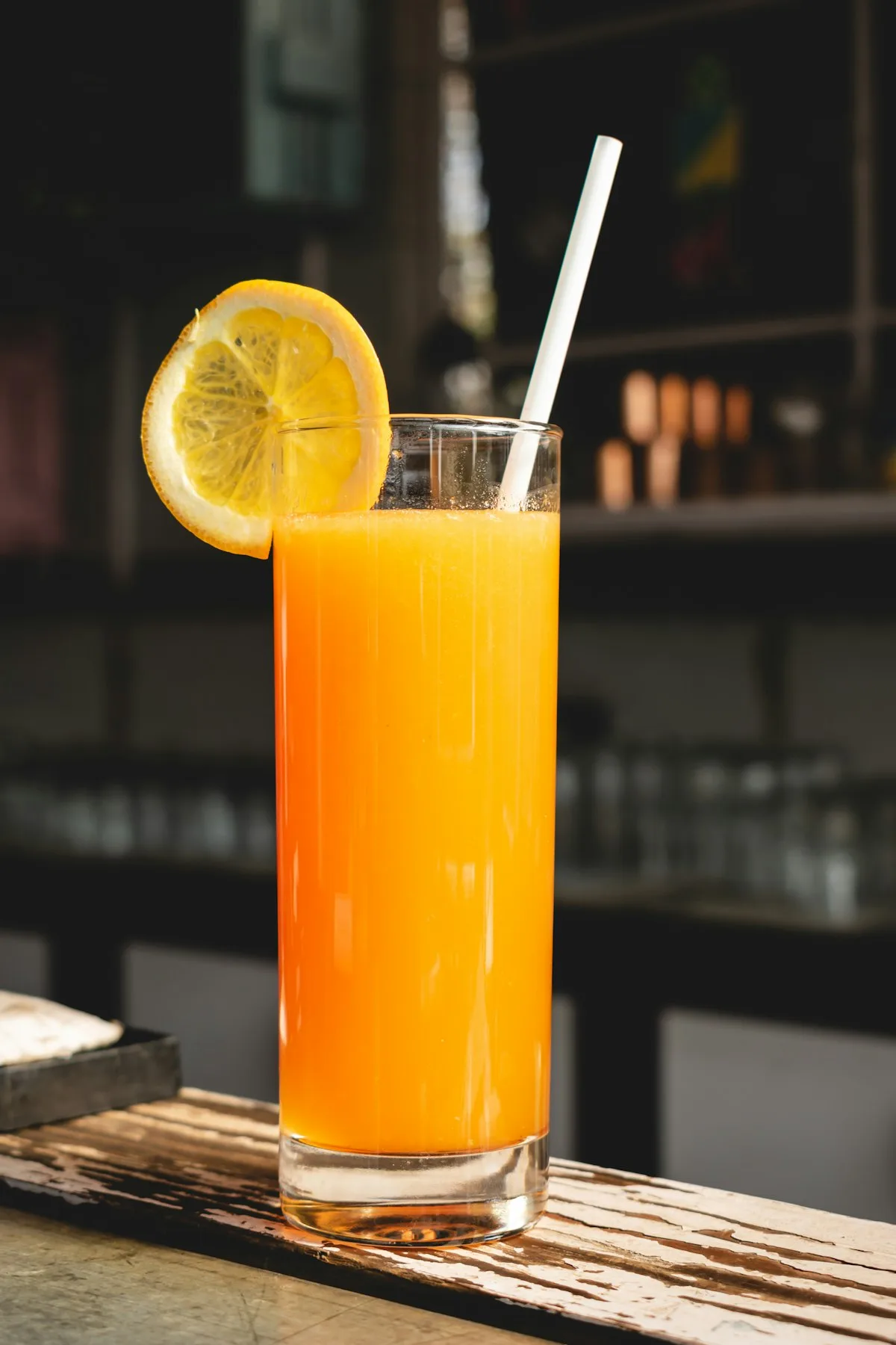 Glasses of fresh orange juice on a wooden table