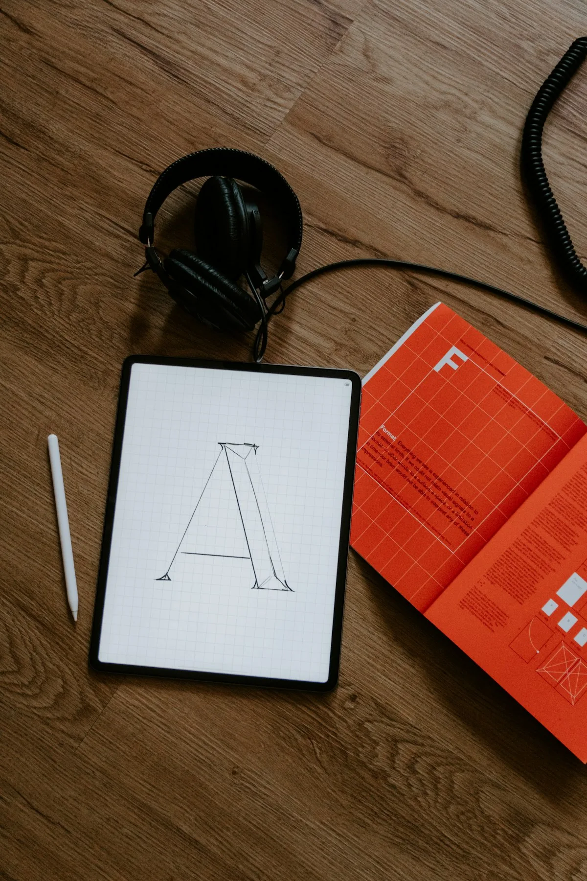 Overhead view of a marketing planning session with printed documents and coffee