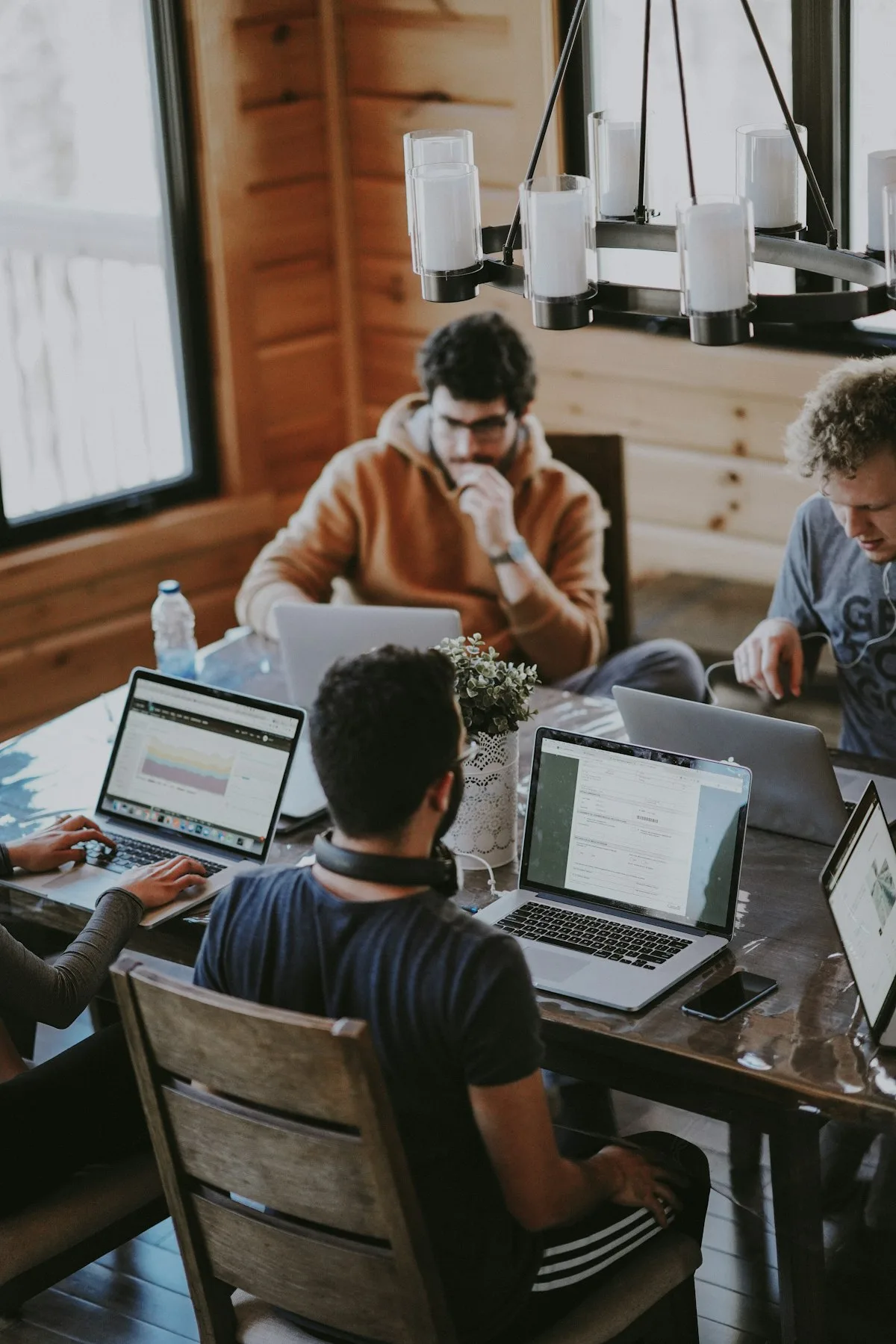 A service team collaborating at a counter in a modern retail environment